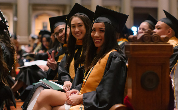 Graduating students smiling